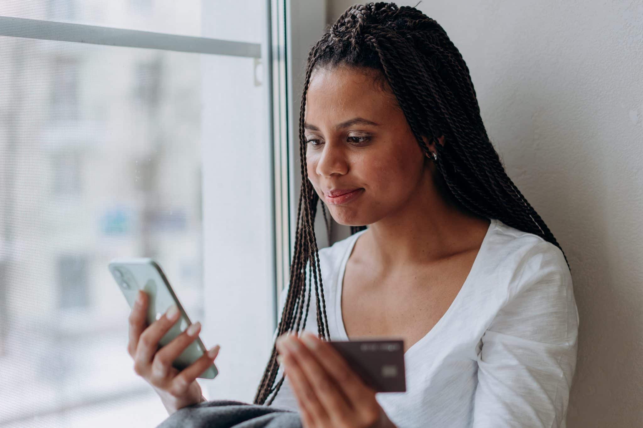 Woman making a purchase on her smartphone.